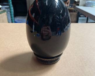 Lot 2511: Black Glazed Ceramic Egg on Metal Collar Stand