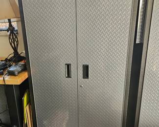 The garage is full of high-end storage cabinets and shelves.