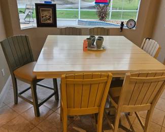 Kanes furniture top of the line bistro height six chair kitchen table measurements and price on sign in foreground
