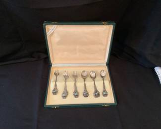 Boxed set of demitasse forks and spoons. Marked “800.” Made in Italy.