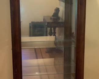 Six shelf display cabinet. Side panel accessible. 32 1/2” W x 14 1/4” D x 76 1/2” H.