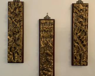 Three intricately carved Chinese decorative panels. Each 6” W x 23”H.