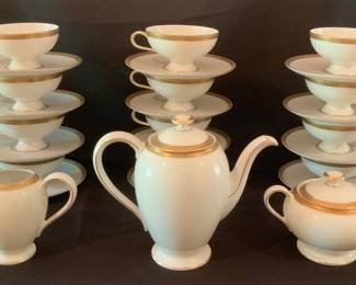 Twelve coffee/tea cups and saucers, coffee/tea pot, creamer and sugar