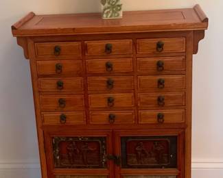 Reproduction “antique” Chinese apothecary cabinet. 24 3/8” W x 10 5/8 D x 30 1/2” H.