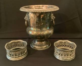 Pair of white brass wine bottle coasters, Sheffield silver plated ice bucket with liners