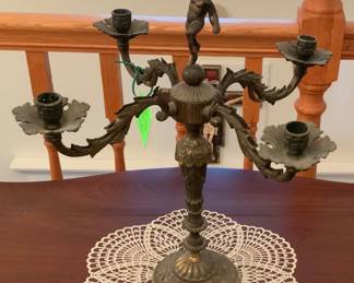 Brass plated four arm candelabra. 15” W x 16” H.