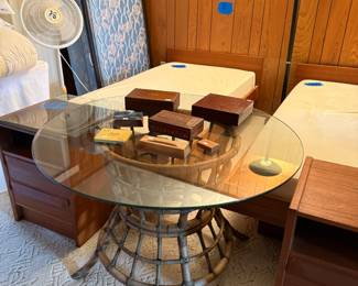 Round glass top table with rattan base