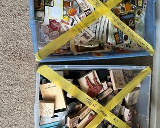 Tubs of stickers and stamps for scrapbooking
