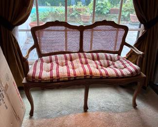 A pair of French provincial Caine bench