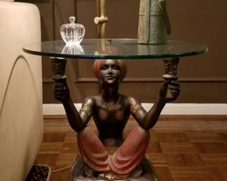 One of pair Blackamoor tables
