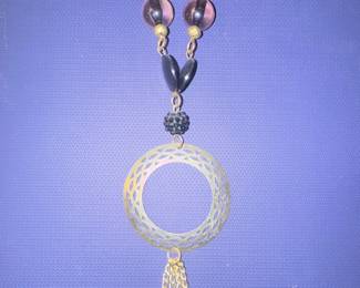 Gold-tone Geometric Pendant Necklace with Purple Beads and Tassel