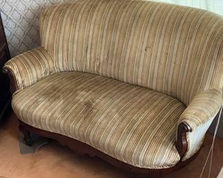 Antique Victorian-Style Striped Settee / Loveseat Designed with curved silhouette rounded rolled arms and elegant dark wood trim accents.