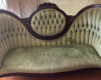 Antique Victorian Tufted Velvet Parlor Sofa Stunning antique Victorian parlor sofa featuring an ornate, heavily carved dark wood frame with a beautiful crown crust.