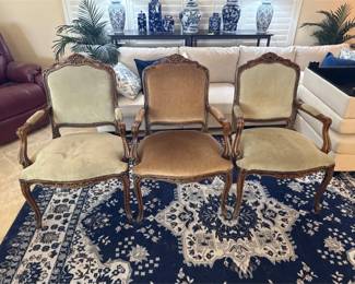Three Upholstered Captains Chairs