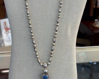 Silver/Lapis Lazuli, reverses to Malachite, Onyx, Turq
