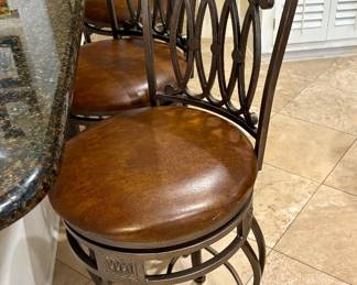 Three Faux Leather and Iron Chairs 
