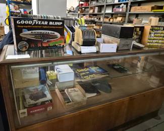 Antique wooden display case with sliding doors and glass top