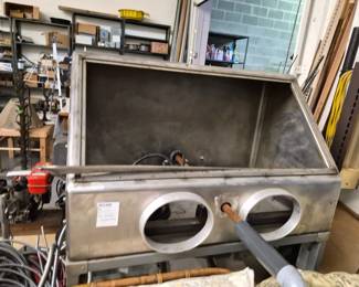 Stainless steel sanding unit on metal stand