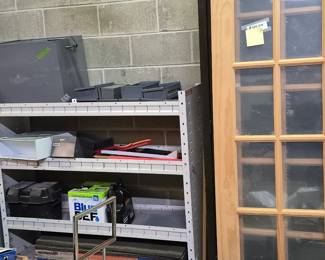 Equipment rack for service van and gray metal box fits between seats