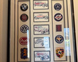 Framed collection of classic car patches and logos