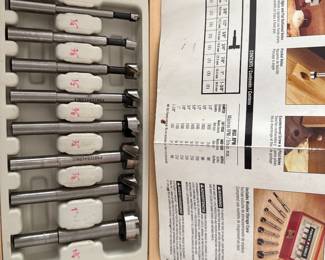 Porter-Cable 8-Piece Forstner Drill Bit Set (Model PC1008), stored in its signature wooden presentation case.