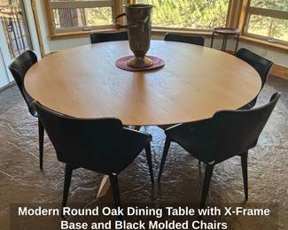 Modern Round Oak Dining Table with XFrame Base and Black Molded Chairs