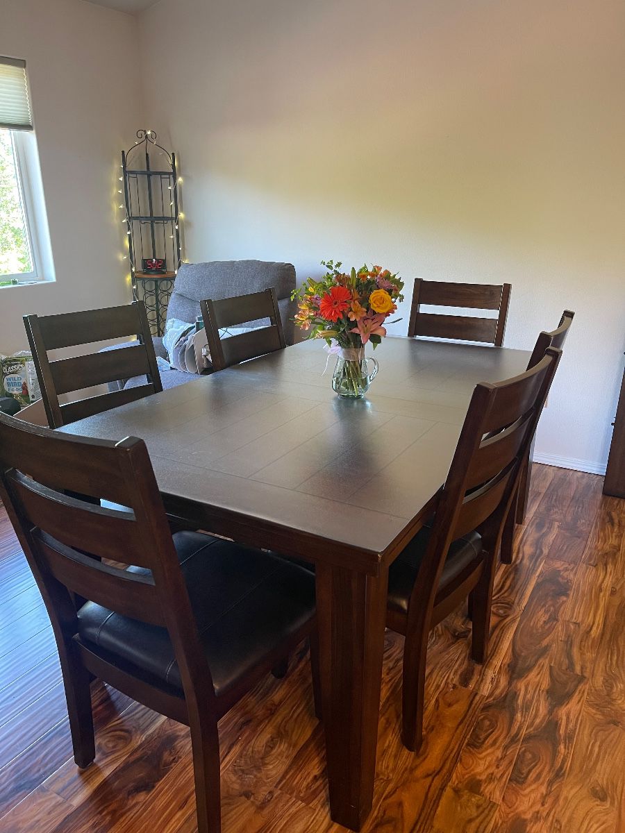 Dark wood kitchen table with six chairs