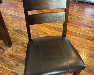Six dark wood padded kitchen chairs