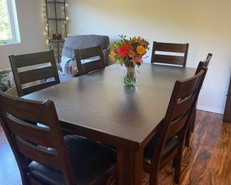Dark wood kitchen table with six chairs