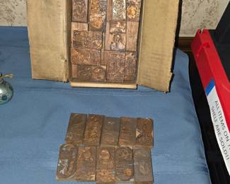 vintage letterpress printing blocks, featuring etched copper plates mounted onto wooden blocks