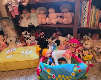 Care bear bag, Rainbow Brite, troll dolls and other vintage toys.
