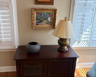 modern tv stand, brass lamp, wall art (top painting of boat not available)