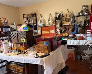 Check out the handbags on the back wall
