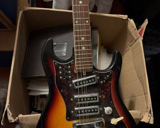 vintage Japanese electric guitar from the 1960s or 1970s with case