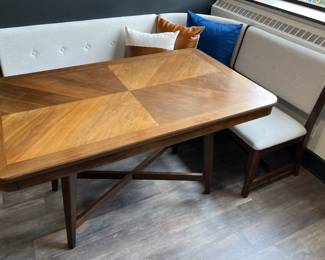 One of three matching modern dining tables by Bernards Furniture Group, and one of two matching Bernards Dorval white and wood modular corner dining nook benches.