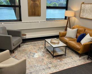 One of 12 rooms containing modern furniture and decor.