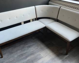 Closer view of one of the two matching Bernards Dorval white and wood modular corner dining nook benches.