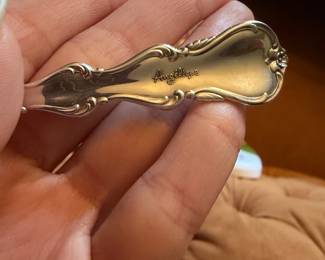 Vintage Angélique ornate sterling flatware, floral/scroll handle pattern.