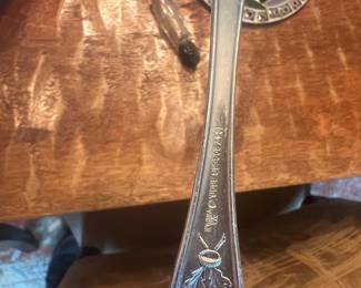 Antique 1847 Rogers Bros. I.S. Silverplate Serving Utensil featuring an unusual raised figural motif with engraved evergreen/foliate decoration, marked 1847 Rogers Bros. I.S.