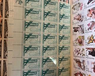 Vintage U.S. Mint Postage Stamp Collection – Full & Partial Sheets, including International Geophysical Year 3¢ stamps, Mackinac Bridge 5¢ commemoratives, 1987 North American Wildlife 22¢ stamps, and additional U.S. issues.