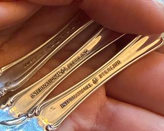 International Silver Co. “Angeline” Sterling Silver Flatware, ornate floral/scroll pattern, marked INTERNATIONAL STERLING.