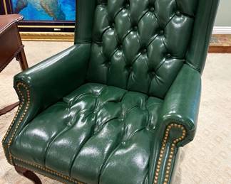 Chesterfield wingback armchair in a dark green color $500