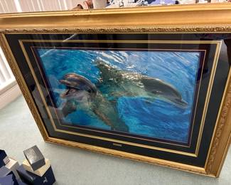 d "Varua Moana" (or Valamoana) by marine wildlife artist Christian Riese Lassen, featuring two dolphins swimming in bright blue, sunlit ocean water. $3,000