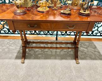 Regency-style mahogany drop-leaf sofa table features a beautifully figured flame mahogany top and elegant lyre-form end supports. $1,500