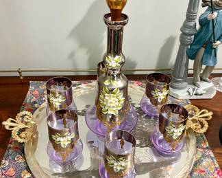vintage mid-century lavender purple and gilded decanter set features hand-painted white floral enamel details and 24K gold gilding. $2,00