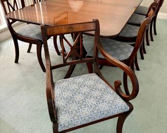 mahogany double-pedestal dining table set features Chippendale-style chairs upholstered in a blue patterned fabric. $2,800