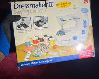 Dressmaker II Sewing Center. Key Features: A compact, portable electric sewing machine designed for ease of use, capable of handling fabrics from delicate silk to heavy denim.