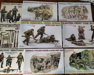 Lots of World War 2 Dragon and Tamiya figurines and tanks with the aftermarket metal accents and all new in box (many more not photographed )