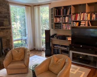Neutral pair of leather swivel chairs