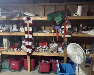 Multiple shelves and bins of Christmas decorations, Santas, trees, ornaments and collectibles